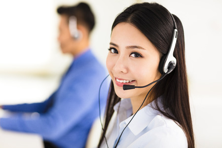 Beautiful call center agent working in officeの写真素材