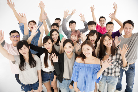 top view of happy young group with hands upの写真素材