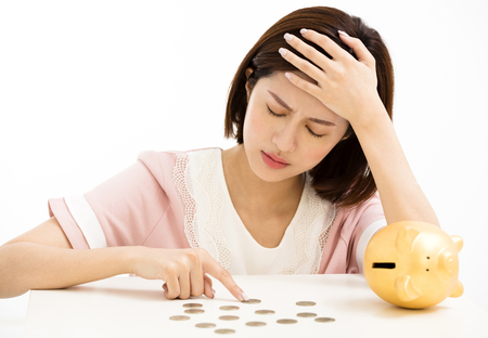  stress young woman with piggy bank 
の写真素材