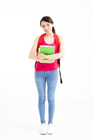 young student girl with books isolated on whiteの写真素材