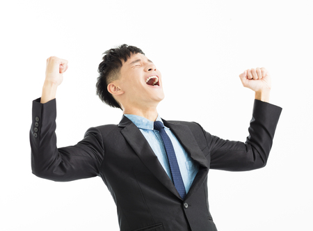 Excited businessman celebration success with hand upの写真素材