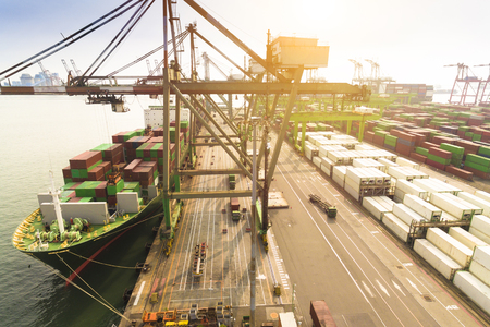 Aerial view of cargo dock and Container Shipの写真素材