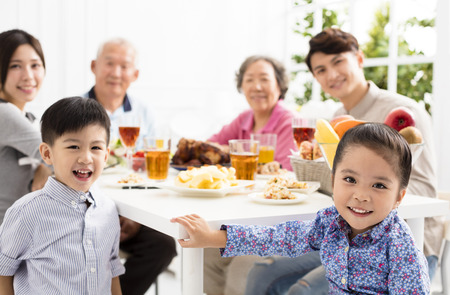 happy asian family having dinnerÂ at homeの写真素材