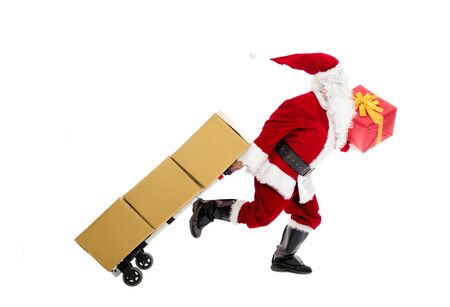 Santa Claus running and delivering Christmas presentsの写真素材