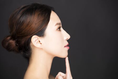 side view of beauty face isolated on black の写真素材