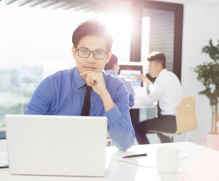 young business man work in office on computerの写真素材