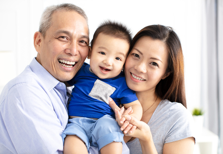 happy grandparent with baby grandsonの写真素材