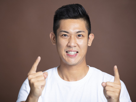 happy Young man with  victory gestureの写真素材