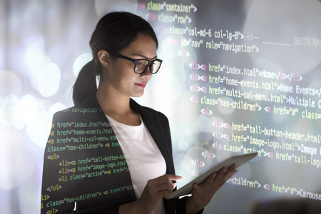 young business woman working in office with tabletの写真素材