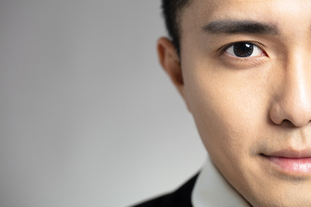 half face of Handsome asian young menの写真素材