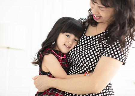 Lovely little girl with her grandmotherの写真素材