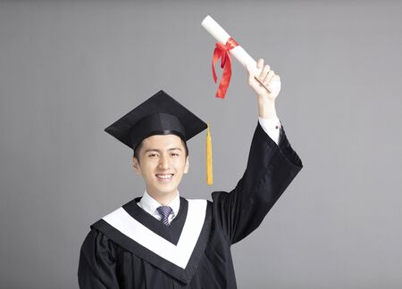 Cheerful young graduated studentの写真素材
