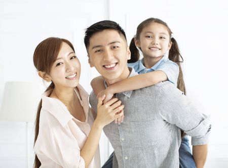 Happy family and child having fun togetherの写真素材
