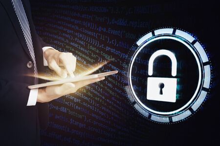 business man using  tablet computer and cyber security conceptの写真素材