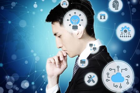 Serious businessman thinking, technology and business concepts