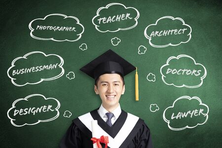 smiling graduation thinking about different jobs conceptsの写真素材
