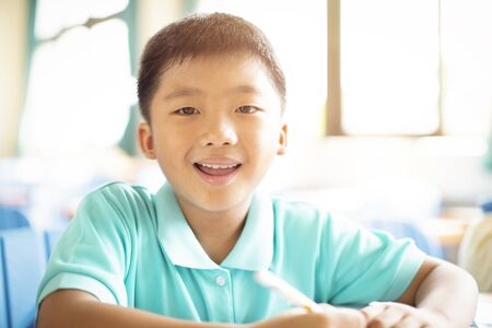 happy elementary school kids  in classroom