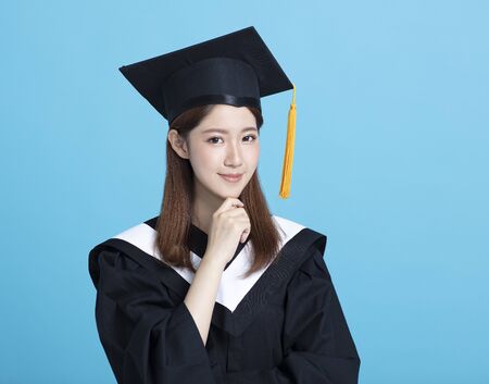 Happy asian female graduate studentの写真素材