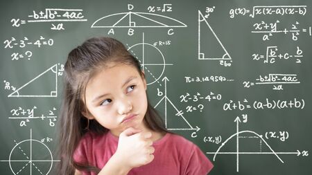 little girl thinking about mathematics problemの写真素材