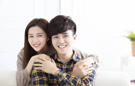Cheerful young couple at home in the morningの写真素材
