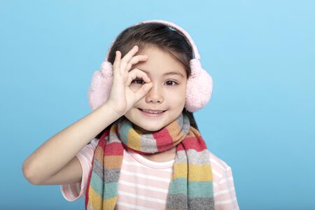  portrait of smile little girl in winter clothesの写真素材