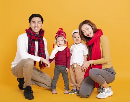 happy asian family in winter clothesの写真素材