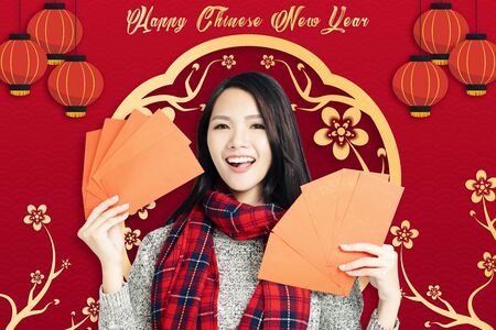 asian young woman celebrating for chinese new year.の写真素材