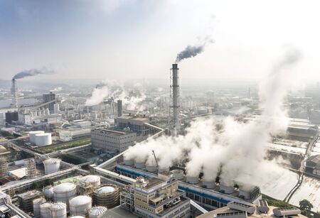 Aerial view of industrial area with chemical plant. Smoking chimney from factory