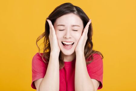 young asian woman with surprised gestureの写真素材