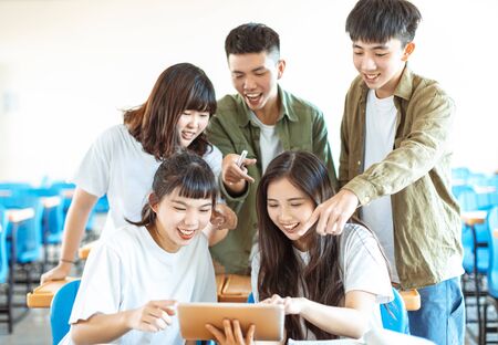 collage Student  discuss with Classmate in Classroom の写真素材