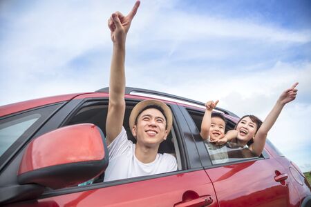 Happy asian family on  road trip in the carの写真素材