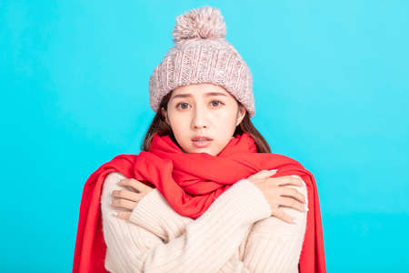 freezing young woman in winter clothの写真素材
