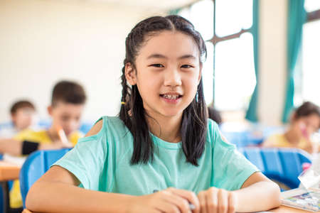 beautiful asian little girl studying in the classroom.の写真素材