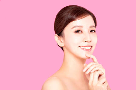 Close up of beautiful young woman's face with clean perfect skinの写真素材