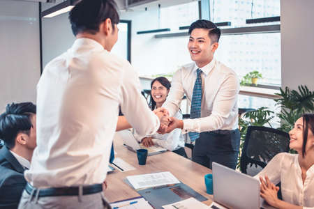 happy Business people shaking hands in conference roomの写真素材
