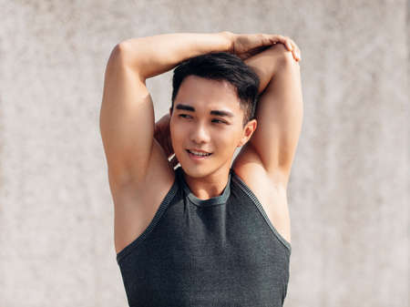 Handsome sportive man doing workout outdoorの写真素材