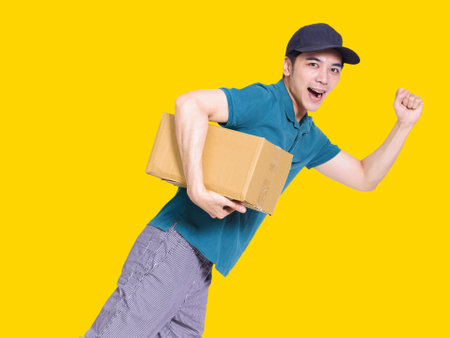 young man smiling and making thumbs up gestureの写真素材