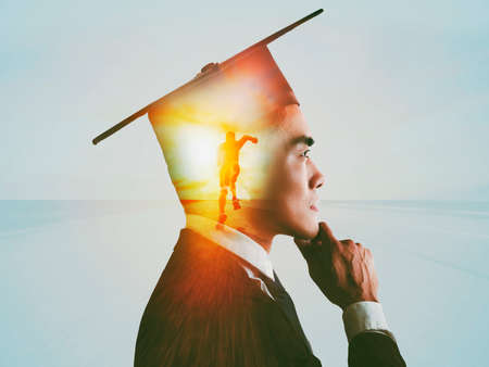 Double exposure of businessman and running forward conceptの写真素材