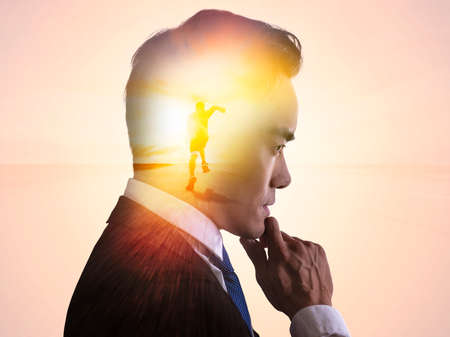 Double exposure of businessman and running forward concept
