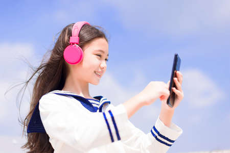 Teenager student girl shouting and announcing somethingの写真素材