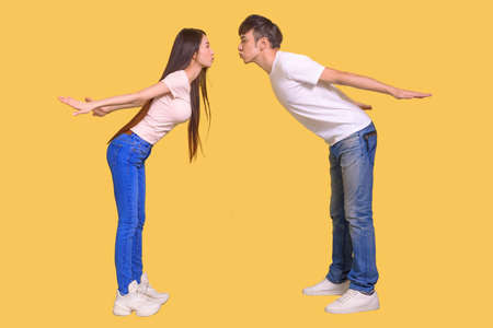 young Asian couple being happy and kissingの写真素材