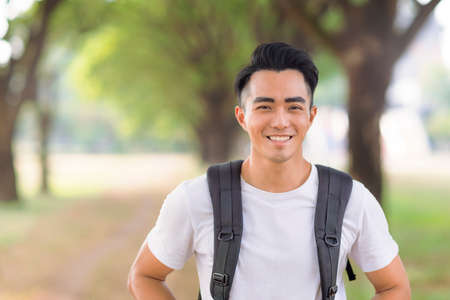 Smiling young man looking at camera