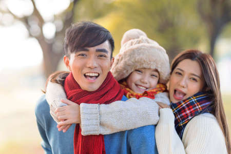 happy family in autumn parkの写真素材