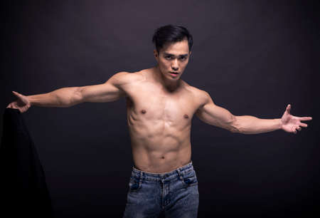 Asian young man with fitness bodyの写真素材