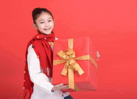 Happy Girl holding Red gift box