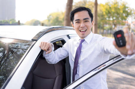 Happy Business Man showing the car keys