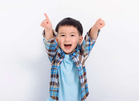 Happy little boy hand pointing to cameraの写真素材