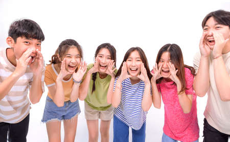 Happy young group student shouting and announcing somethingの写真素材