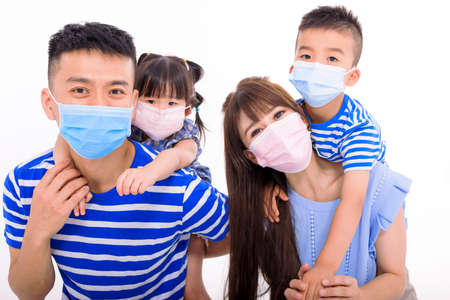 Family wearing protective medical mask for prevent virus Covid-19の写真素材