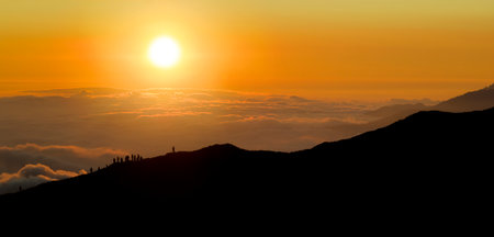 Aerial view of mountains in orange clouds at sunset in summer. Hehuan Mountain, Taiwan.